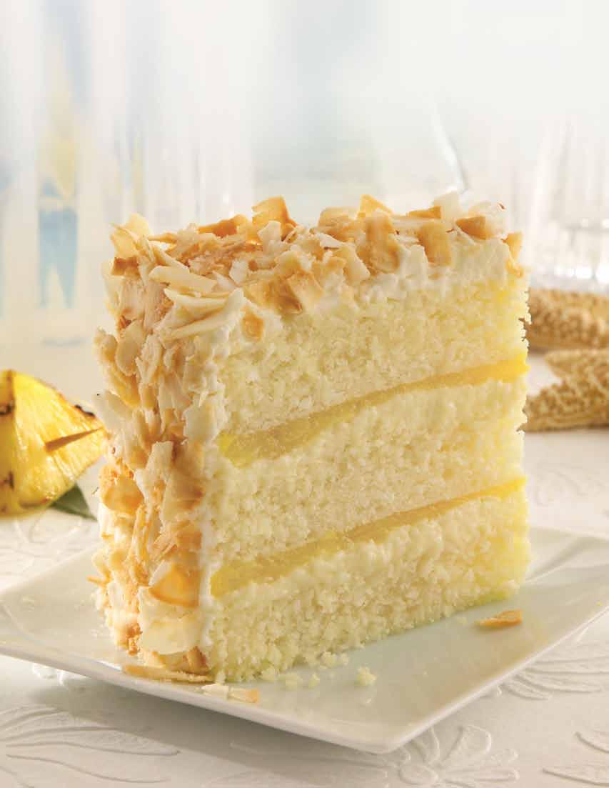 Piña Colada Cake We pile high three big layers of moist piña colada-glazed coconut cake with refreshing pineapple compote and