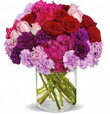 Yes, we now do flowers, too! Our Radiant Blooms Bouquet (shown) $128.