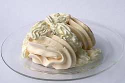 Meringue is a type of dessert, often associated with Swiss and French cuisine, made from whipped egg whites and sugar, and occasionally an acid such as cream of tartar or a small amount of vinegar.
