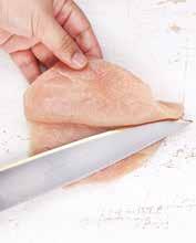 With a sharp knife, cut into one side of the chicken's breast.
