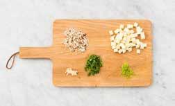 A GOOD START PREPARATION Prepare the stock. Coarsely chop the almonds, press or finely chop the garlic and finely chop the coriander. Grate the lime rind (zest) and squeeze out the lime juice.