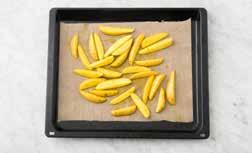 A GOOD START PREPARE THE POTATOES Pre-heat the oven to 200 degrees and take the butter out of the refrigeratort. Thoroughly scrub or peel the potatoes and cut into wedges.