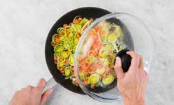 FRY THE VEGETABLES Heat half the olive oil in a wok or deep saucepan and gently fry the onion and garlic for 2 3 minutes at medium-low heat.