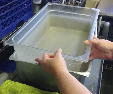 prevent separation of the cream. The food preparer reported cooling the soup by placing it in several plastic trays set in metal trays (Photo 2) filled with ice, with fans (Photo 3) blowing at them.