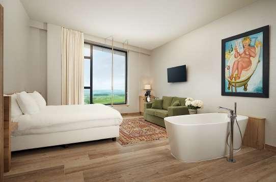 These spacious rooms have an open bathroom with bath and shower.