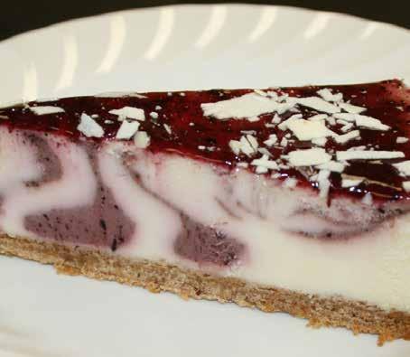 9" Saskatoon Berry Cheesecake A rich and creamy cheesecake nestled on a graham crumb base with a tasty