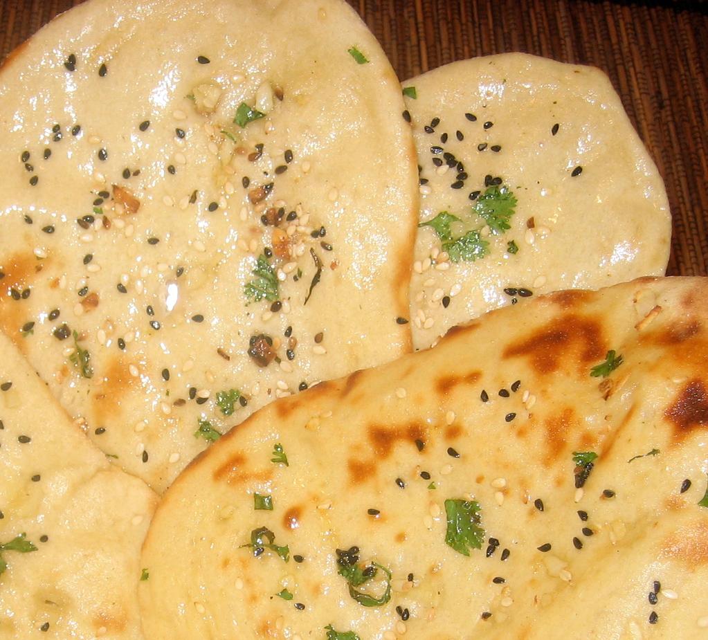 Tandoori Bread 11. Plain Naan Indian bread baked in Tandoor 12. Roti (Chapatti) Wholemeal bread finished with garlic 13. Garlic Naan (Garlic Roti) Tandoori bread finished with garlic 14.