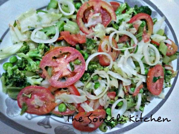 QUDAAR SALAD Ingredients 2 tomatoes 1 onion ½ cup of peas 1 small broccoli ¼ cabbage 2 celery sticks Salt to taste 2 tablespoons of olive oil for cooking Juice of one lemon Instructions 1.