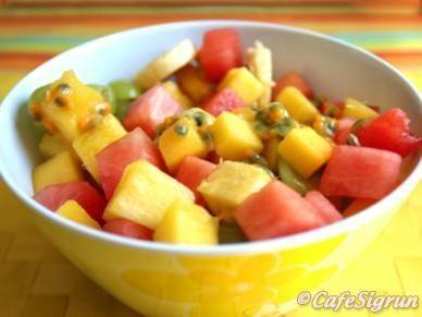 AFRICAN FRUIT SALAD One-quarter pineapple, trimmed and cut in cubes One-quarter seedless watermelon, trimmed and cut in cubes 1 mango, trimmed and cut in cubes 3 passion fruit, seeds scooped out 1