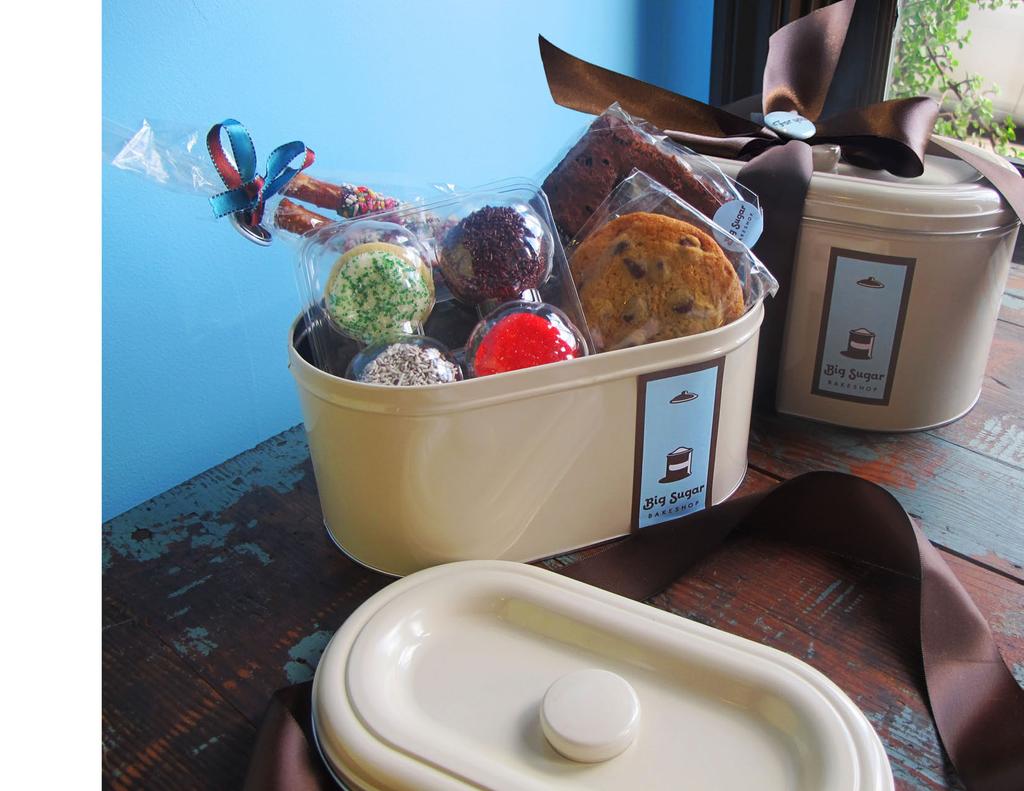Gift Tins Large $50, Small $35 Back by popular demand, the vintage oval-shaped beige tin has returned! The large tin is filled with mini cupcakes, bars, cookies, pretzels and soda fountain fudge.