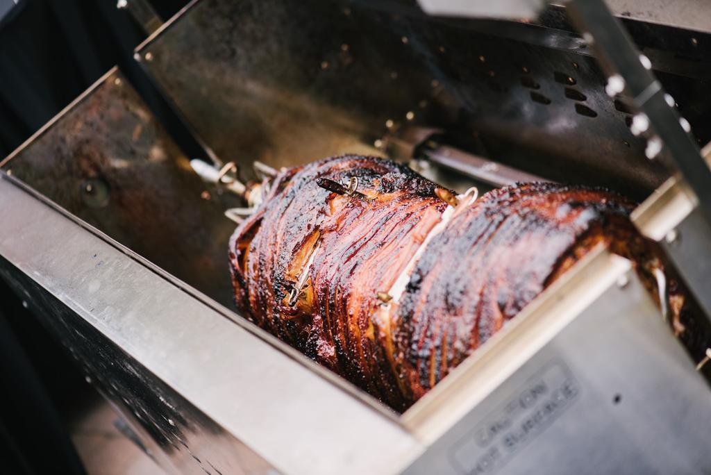 THE HOG (Minimum of 100 guests) Hog Roast with crackling served in fresh bakery rolls accompanied