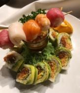 13 Rainbow Dragon-Shrimp tempura, asparagus, avocado, topped with tuna, salmon and white fish.