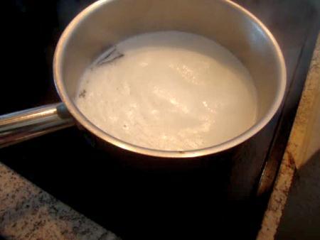 of the sugar in a saucepan. Bring the milk to a boil.
