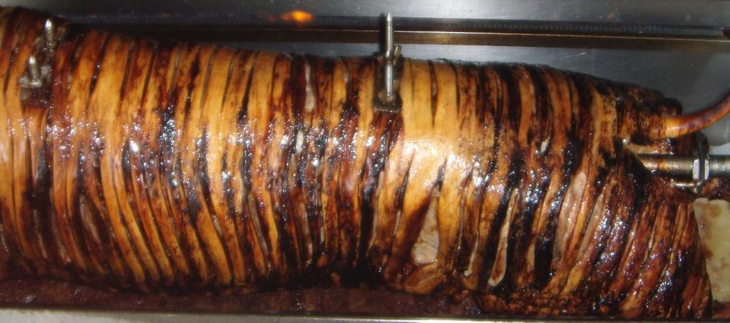 BARBECUED HOG ROAST Whole English porker spit roasted in a special roasting unit in front of your guests.