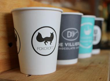 CapeCup Custom Printing YOUR LOGO HERE We do custom branding on sleeves and paper cups.