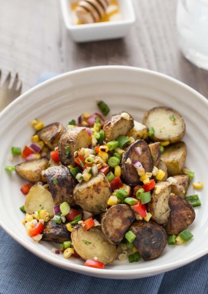 GRILLED POTATO SALAD WITH HONEY CHIPOTLE VINAIGRETTE Ingredients: 1lb baby potatoes, cut in half 2 ears corn 2 tablespoons olive oil, divided 1 jalapeno, seeds removed and diced ½ cup red pepper,