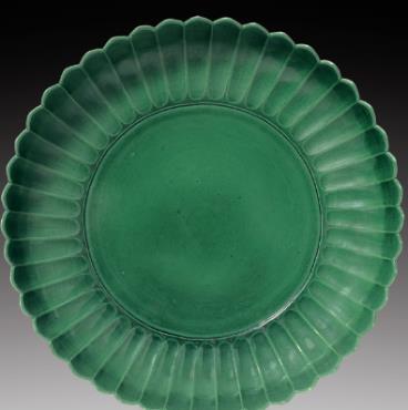 18. Dish moulded in the shape of a chrysanthemum Porcelain with green glaze Qing