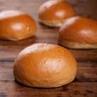 BRIOCHE BUN 70G A French-style brioche burger bun enriched with butter and milk, topped with sesame seeds.