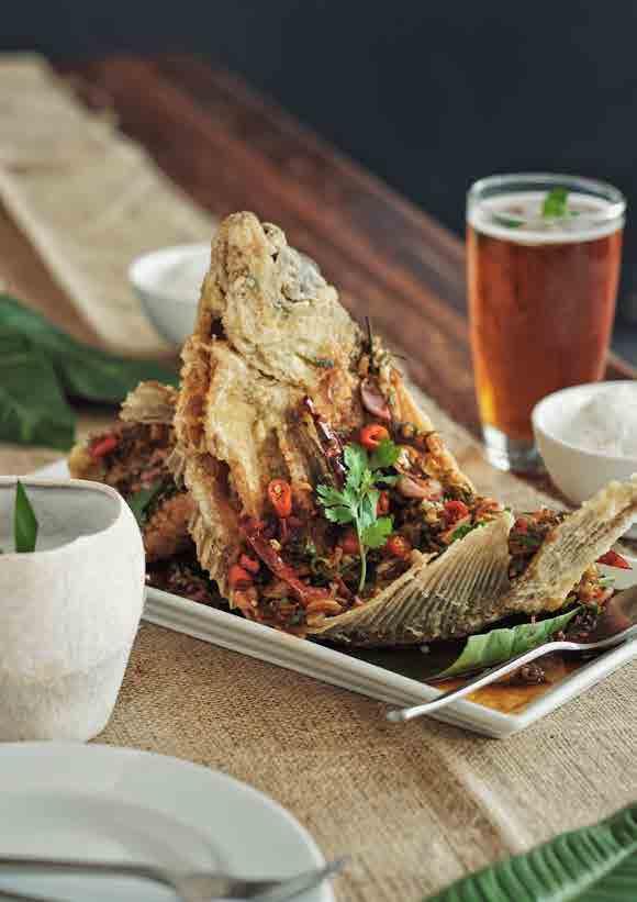 fish pla samun pai crispy thai herb fish 160 batter fried fish topped with thai herbs and tamarind sauce that gives its spicy, sweet and sour flavour.