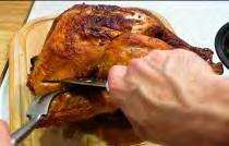 Start carving the turkey by making 3 cuts down the