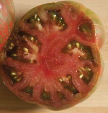 56 days. Determinate. Green Zebra A delicious, tangy salad tomato, ripe just as the green fruit develops a yellow blush, accentuating the darker green stripes. The 3-4 oz.