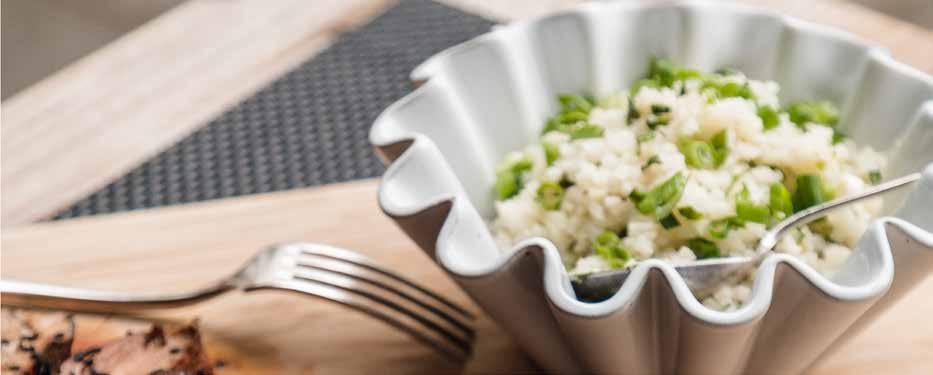 WEDNESDAY CILANTRO LIME CAULIFLOWER RICE 1 tablespoon extra-virgin olive oil 2 green onions, white and green parts, sliced thin 2 garlic cloves, minced 1 12-ounce bag frozen riced cauliflower 3