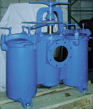 diverter assembly which results in a very compact unit for strainers of this size.