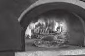 The Oven will become hot enough and the small fire on top will generate radiant heat. For pizzas, the purpose of the flame is to melt the cheese and crisp the top.