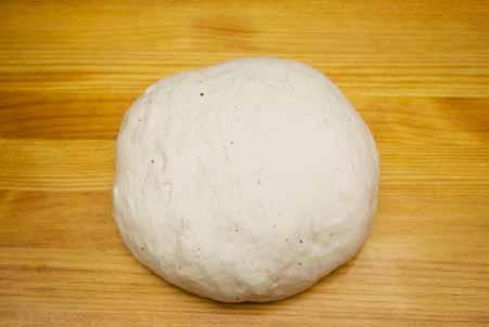 7 5 Add the flour and salt and combine until dry enough to knead. Transfer the dough to the counter and start kneading.