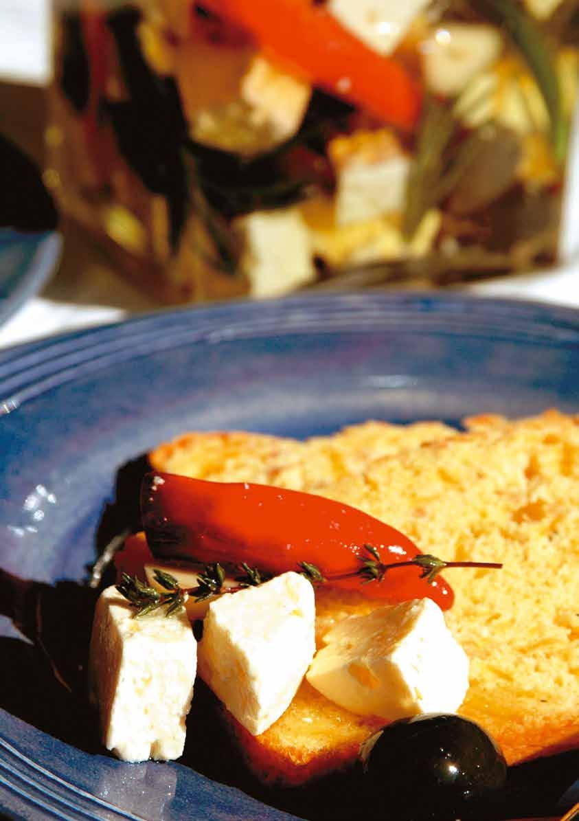 Marinated Feta Cheese 4 cloves of garlic, quartered lengthwise 400g Clover Feta Cheese, cut into 2,5 cm cubes 100g marinated sundried tomatoes, quartered lengthwise (optional) 2-3 red chillies,