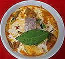RED CURRY Red curry with herbs and spices in coconut mil with bamboo shoots, zucchini, lime leaves and fresh basil. 207.
