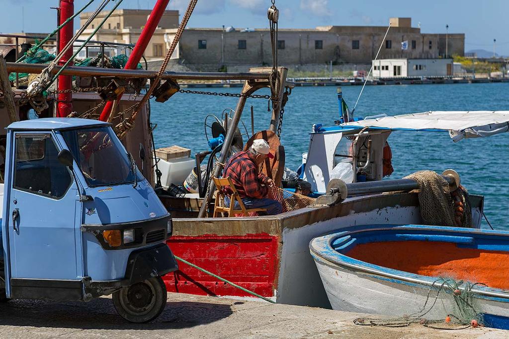 Morning Fish Market, Trapani You ll experience an old world feel as the locals haggle over the catch of the day and