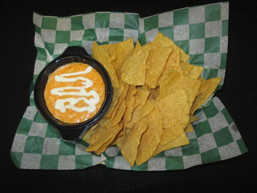 Buffalo Chicken Dip 6 oz (bw) Raw Tortilla Chips 1 tsp PGS Seasoning 1 each Buffalo Chicken Dip 1/2 oz (bv) Ranch Dressing Tools Needed: Gloved hands, microwave Approximate Total Cook Time: 3 minutes