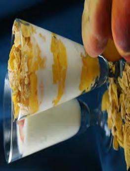cornflakes per 1 (15 oz.) canned chopped peaches in 100% fruit juice 1 container (16 oz.) low-fat vanilla yogurt 3 oz. corn flakes 1. Drain peaches and place in bowl. 2. Add yogurt and mix gently. 3. Have each student spoon 2 Tbsp.