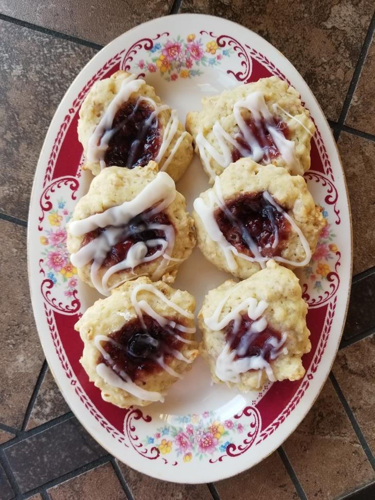 1 cup sugar White Chocolate Raspberry Thumbprints ½ cup butter or margarine, softened ½ cup nonfat sour cream 2 tablespoons milk 2 eggs 2 2/3 cups flour 2 cups rolled oats 1 teaspoon baking soda 5