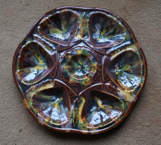 156 A six well oyster plate with treacle coloured background and