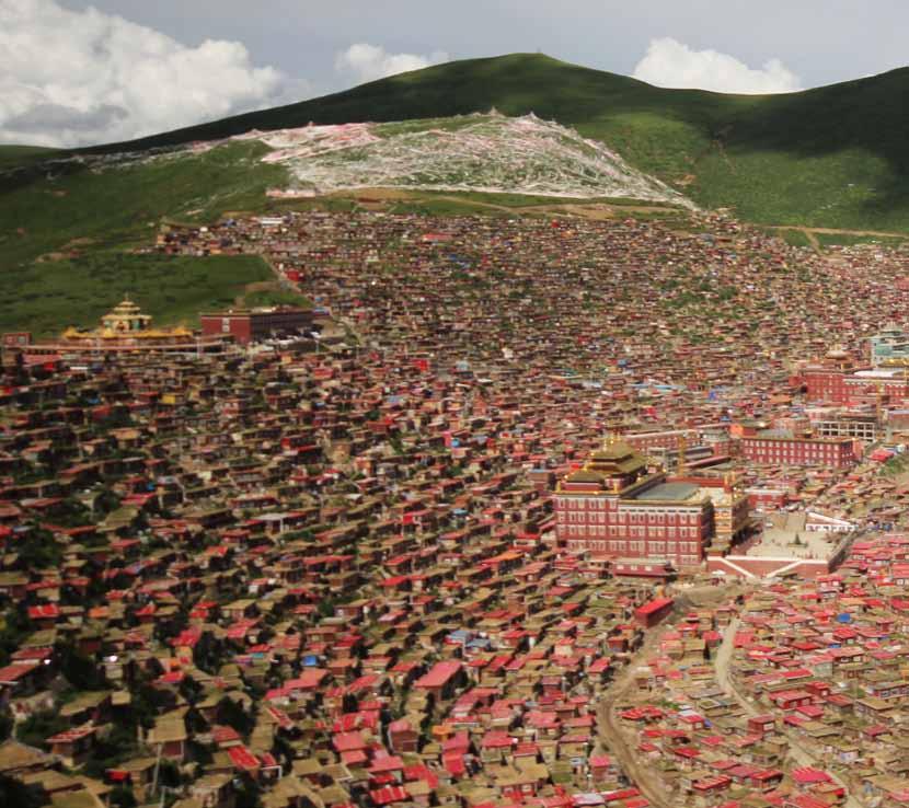 Sertar--The Essence of Buddhism About 30km north of a tiny town called Sertar, in a valley surrounded by absolutely nothing, lies a massive sprawl of tiny box-like houses built into the sides of the