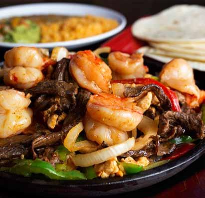 JORGE'S FAJITA BAR We ll deliver them sizzling on a skillet with onions and green peppers, along with warm tortillas, lettuce, tomatoes, and. Comes with Spanish rice and homemade refried beans.