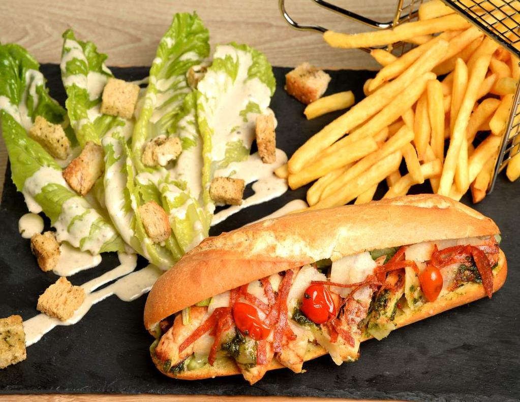 tortilla bread, served with French fries, guacamole and sour cream CHICKEN CELEBRITY 13000 Grilled chicken, iceberg, pickles, tomato, corn, mixed with our flavored garlic mayo, served with sour