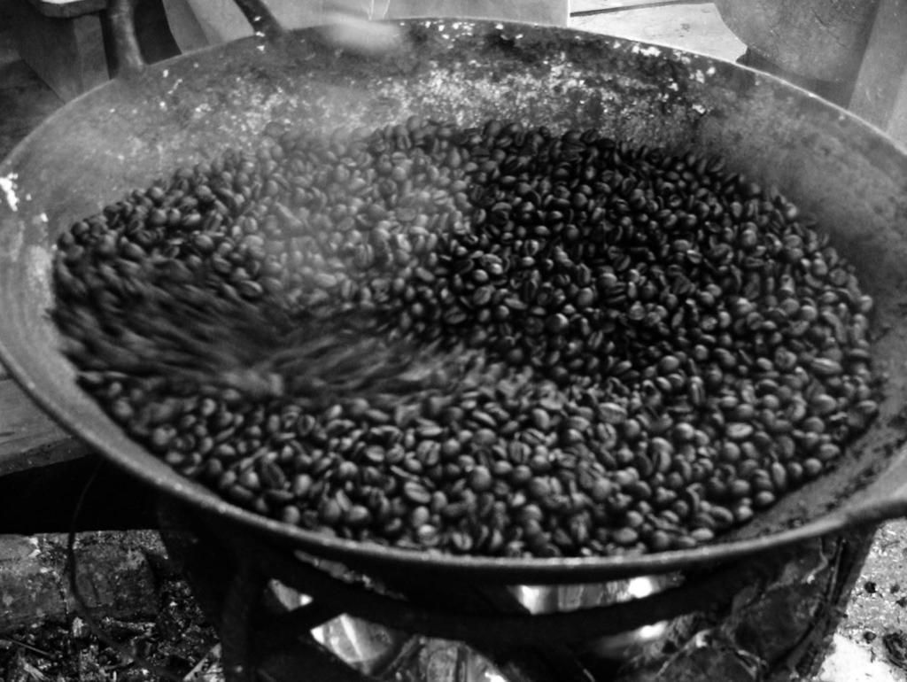 Wok roasted coffee Pictured a farmer is wok roasting coffee for us to taste. We ended up purchasing their entire crop about 52,250 pounds.