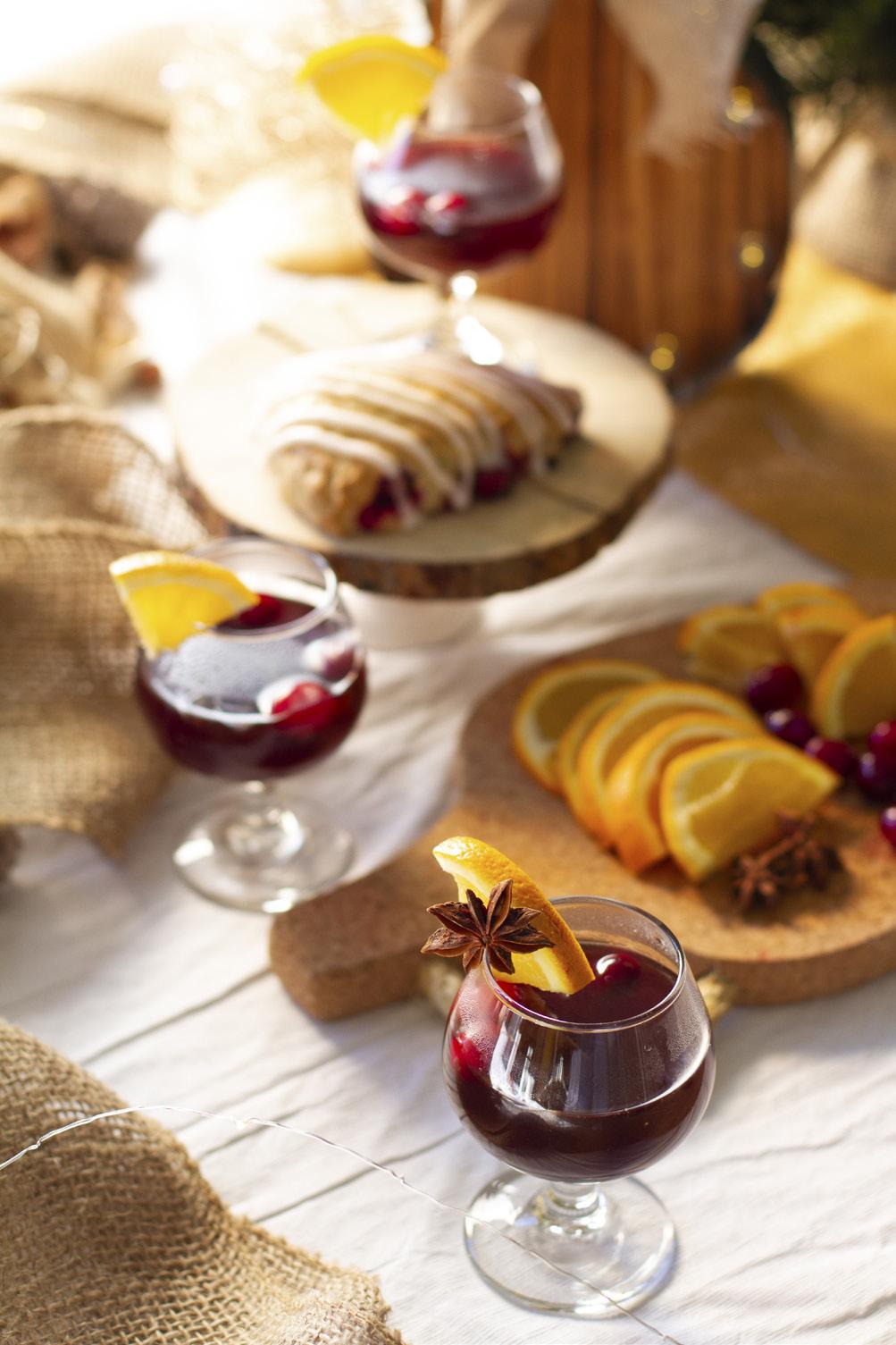 Merrily Mulled Wine This is the ideal gather-around-the-table holiday refreshment for your next party. The smell alone of this mixture melding in your slow cooker will put you in the spirit.