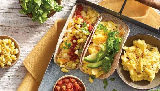 DIY Egg Tacos FAST & FABULOUS DINNERS Top egg tacos with charred corn kernels, sliced avocado, cilantro and hot sauce.