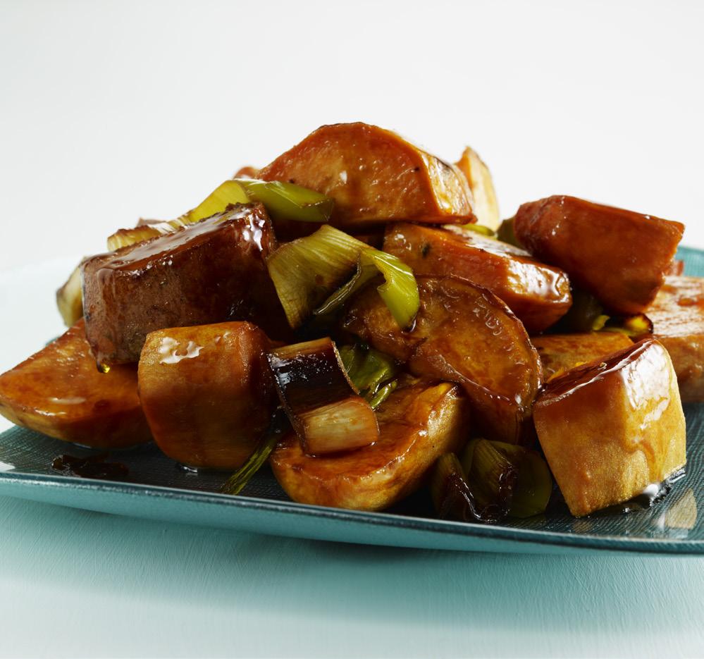 3 Place the sweet potatoes and leeks into a large bowl. Toss with the oil to coat all the vegetables. Pour in a single layer onto prepared pans. Roast, uncovered, for 30 minutes.