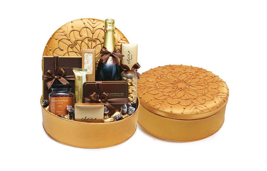 GOLD SPARKLE HAMPER A gold hamper with an intricate design on its cover, ideal for a selection of