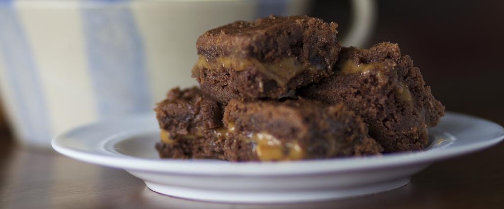 IRWIN S SUPER BROWNIES YIELDS 24 Adapted from In Order to Serve, Christ Episcopal Church Combine cake mix with butter and ⅓ cup milk. Spread half of batter into greased 9x13 baking dish.