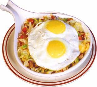 Skillet A Skillet full of Hash Brown Potatoes, Chorizo Sausage, Onions, Green Peppers and 3 Eggs, Any Style, with shredded Cheddar Cheese.