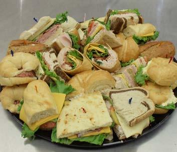 Assorted Sandwich Tray Subs, Clubs, Bundles, Croissants, Focaccia, Wraps, Bagels, and Turkey Natural Sandwiches to please the entire crowd.