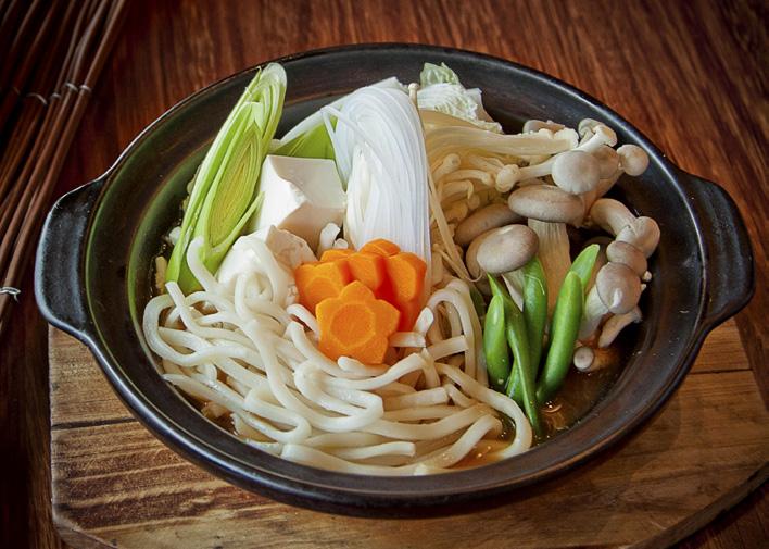 Nabe v 野菜うどん鍋 Japanese hot pot of seasonal vegetables, tofu and udon noodles slow-simmered