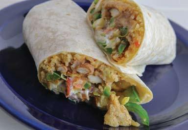 29 NEW Burrito Wrap A large flour tortilla filled with your choice of grilled chicken or steak, rice, beans, onions, bell peppers, lettuce, sour cream and cheese. 9.