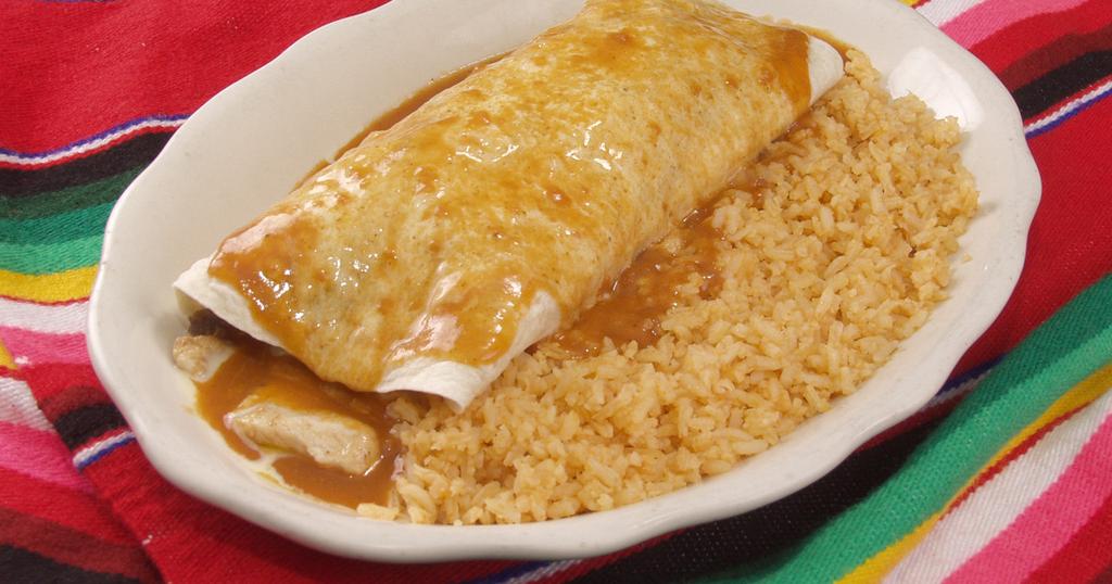 99 NEW Lunch Special #4 One burrito stuffed with your choice of beef tips, shredded chicken or ground beef smothered with cheese sauce and enchilada sauce. Served with rice 6.